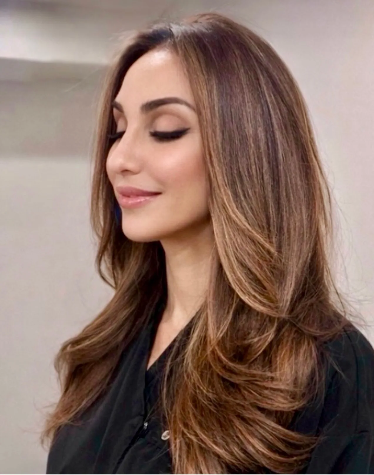 Soft caramel dimension and long, flowing brunette layers by Ayfer Deniz